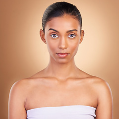 Image showing Skincare, beauty and portrait of Indian woman for wellness, healthy skin and facial treatment in studio. Dermatology, luxury spa mockup and serious face of girl with makeup, cosmetics and confidence