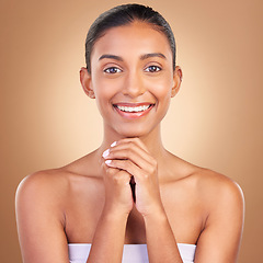 Image showing Beauty, skincare and portrait with indian woman in studio for happy, spa detox and facial. Cosmetics, self care and glow with model on brown background for satisfaction, natural makeup or confidence