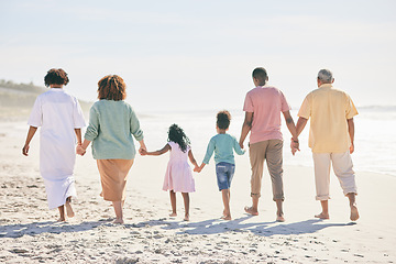 Image showing Family at beach, holding hands and generations walk on sand, people outdoor with grandparents, parents and kids. Together, support and trust, travel to Bali with love, care and bond with back view