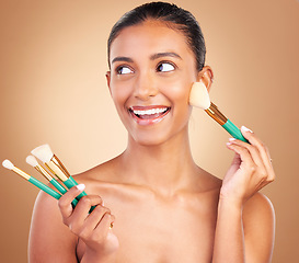 Image showing Makeup brushes, happy and woman with natural beauty, wellness and face shine from cosmetics. Facial skin glow, smile and cosmetic artist brush of a young female model with self care in a studio