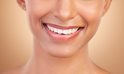 Image showing Woman, smile with teeth and dental with beauty and healthcare, face and mouth closeup on studio background. Skin, glow and whitening with cosmetic care, health and veneers, female and oral hygiene