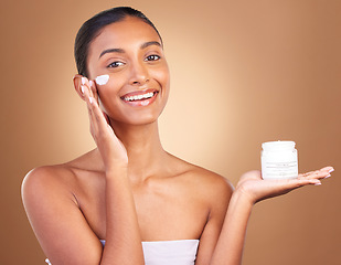 Image showing Skincare beauty, sunscreen product and portrait of a happy woman with cosmetic and spa cream. Isolated, studio background and young model with a smile from face cleaning, cosmetics and dermatology