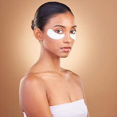 Image showing Skincare, eye patch and beauty with Indian woman for facial, spa treatment and glow. Self care, cosmetics and hydration with female model isolated on brown background for mask, product and youth