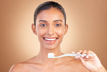 Image showing Woman, smile in portrait with teeth and toothbrush, cleaning with oral hygiene product isolated on studio background. Happy female, orthodontics and dental with mockup space, health and toothpaste