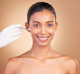 Image showing Woman, face injection and needle, dermatology and skincare, plastic surgery on studio background. Female in portrait, beauty and smile, cosmetics procedure with facelift treatment and cosmetic care