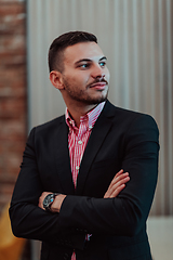 Image showing Portrait of a young businessman in a modern suit. Portrait of the company director in his office. Selective focus