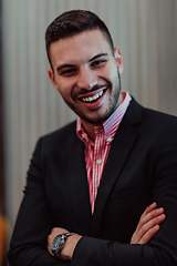 Image showing Portrait of a young businessman in a modern suit. Portrait of the company director in his office. Selective focus