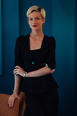 Image showing Blonde business woman, successful confidence on modern blue mat background. Selective focus