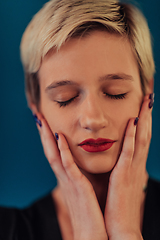 Image showing Photo Beautiful businesswoman, successful confident young woman posing with hands on face. Selective focus