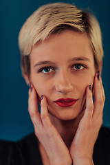 Image showing Photo Beautiful businesswoman, successful confident young woman posing with hands on face. Selective focus