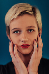 Image showing Photo Beautiful businesswoman, successful confident young woman posing with hands on face. Selective focus