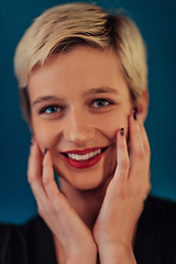 Image showing Photo Beautiful businesswoman, successful confident young woman posing with hands on face. Selective focus