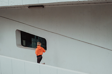 Image showing Women in sports clothes running in a modern urban environment. The concept of a sporty and healthy lifestyle