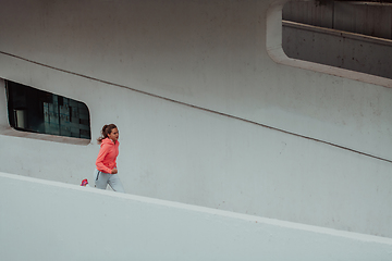 Image showing Women in sports clothes running in a modern urban environment. The concept of a sporty and healthy lifestyle