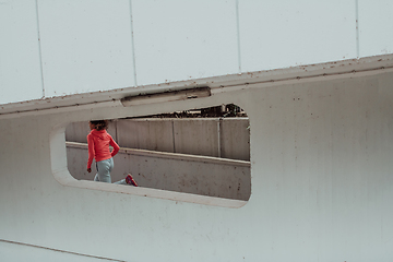 Image showing Women in sports clothes running in a modern urban environment. The concept of a sporty and healthy lifestyle