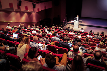 Image showing Business speaker giving a talk at business conference event.