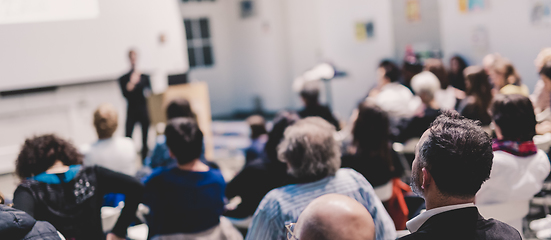 Image showing Woman giving presentation in lecture hall at university.