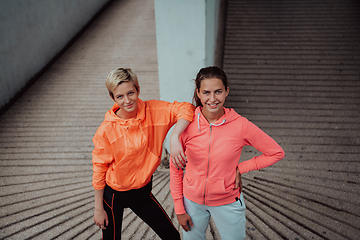 Image showing Two lgbt woman resting after a hard training in an urban environment