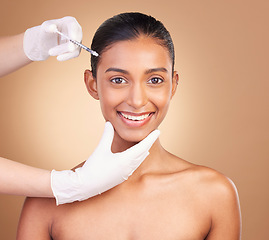 Image showing Woman, face injection and needle in portrait, beauty and dermatology, skincare with plastic surgery on studio background. Female, hands and smile, cosmetic procedure with facelift treatment and skin