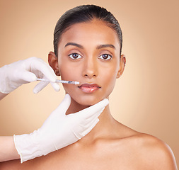 Image showing Woman, face and needle in portrait with beauty and dermatology, skincare with plastic surgery on studio background. Female, hands and injection, cosmetic procedure with facelift treatment and skin