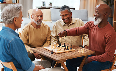 Image showing Chess, friends and board games on wooden table for strategic, cocky or tactical move at home. Senior group of men playing and holding white knight piece after attack showing skill and tactics