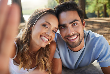 Image showing Selfie, happy and portrait of a couple in nature for a memory, date and bonding. Smile, looking and a young man and woman taking a photo in the woods or forest for relationship memories together