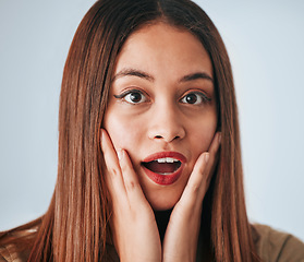 Image showing Shock, expression and portrait of a woman with a reaction isolated on a white background in a studio. Wow, unexpected and face of a girl expressing surprise, amazement and fear emotion on a backdrop