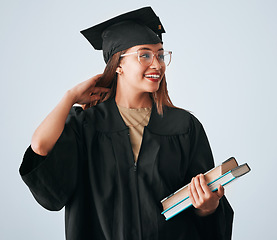 Image showing Graduation cap, books and woman isolated on studio background for happy education, college or scholarship success. Biracial university student or graduate with reading knowledge and learning goals