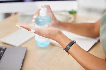 Image showing Hands, covid or sanitizer and a business woman cleaning for hygiene or compliance with regulations in the office. Safety, desk or bacteria and a female employee spraying her hand with disinfectant