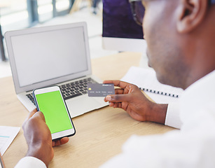 Image showing Phone, credit card and black man with green screen for online shopping, advertising or marketing in office. Mockup branding, ecommerce and male with mobile for fintech, payment or digital banking.