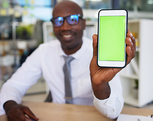 Image showing Phone, hands and black man with green screen for mock up, advertising or marketing in office. Mockup, business and African male entrepreneur with smartphone for branding space or product placement.