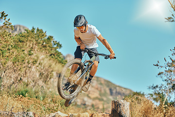 Image showing Cycling, jumping and man on bicycle in the countryside for fitness, stunt and freedom on blue sky background. Nature, biking and guy cyclist training, practice and speed, action and free in Mexico