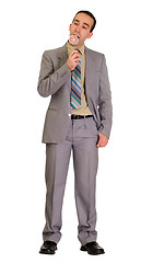 Image showing Businessman Eating Candy