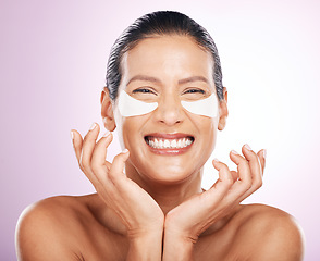 Image showing Face, skincare and woman with eye patches in studio isolated on a purple background. Collagen cosmetics, dermatology and happy, portrait and mature female model with mask for healthy skin treatment.
