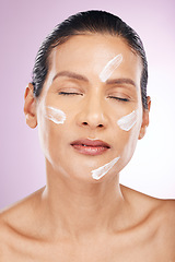 Image showing Face, cream and skincare of woman with eyes closed in studio isolated on a purple background. Mature, cosmetics and female with dermatology lotion, creme or moisturizer for healthy skin or anti aging