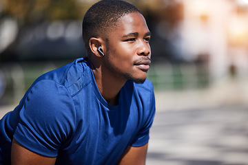 Image showing Fitness, break and man runner relax with music before training, running or morning cardio outdoors. Sports, pause and male athlete breathing, mindset and preparation for marathon practice workout run