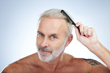 Image showing Hair style, comb and portrait of man in studio for haircare, barber and morning routine. Beauty, hairdresser and salon with senior male on white background for handsome, self care and brushing