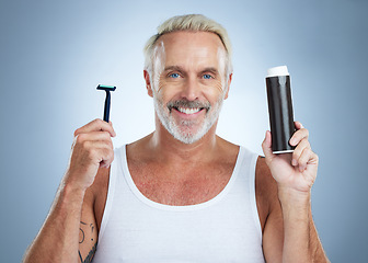 Image showing Senior man, razor and shaving cream for grooming, skincare or hair removal against studio background. Portrait of mature male holding shaver and foam creme for haircare, cosmetics or facial treatment