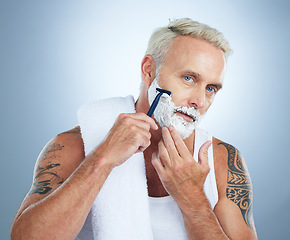 Image showing Senior man, razor and shaving cream for skincare grooming, beard or hair removal against a studio background. Portrait of mature male with shaver, creme or foam for clean facial treatment on mockup