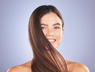 Image showing Woman smile, beauty portrait and hair care in studio for texture, growth and shine on blue background. Aesthetic female model face for self love, haircare and cosmetics for salon or hairdresser