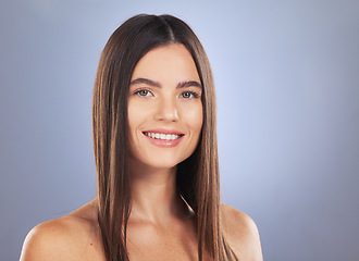 Image showing Woman, beauty and hair care portrait in studio for glow, growth or healthy shine on blue background. Aesthetic female model smile for haircare, self love and cosmetic for salon or hairdresser results