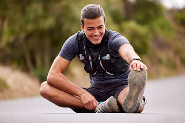 Image showing Fitness, man and stretching legs for exercise, workout or training in the nature outdoors. Happy active male smile in warm up leg stretch to start sports, running or exercising on street or road