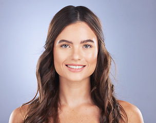 Image showing Woman, beauty and hair care portrait or smile in studio for texture, growth and shine on blue background. Aesthetic female happy for haircare, skincare and natural cosmetics for salon or hairdresser