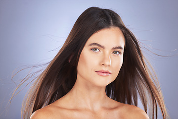 Image showing Woman, beauty and hair for studio portrait with wind, growth and healthy shine on blue background. Aesthetic female model face for skincare, self care and haircare cosmetics for salon or hairdresser