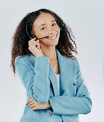 Image showing Business woman, portrait smile and call center with headset mic for telecom customer service against white studio background. Happy isolated female consultant agent smiling with headphones for advice