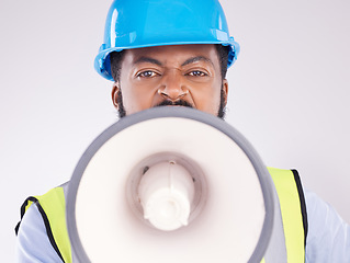 Image showing Engineering black man, megaphone and construction in studio portrait for angry shouting by white background. Engineer, architect or manager with loudspeaker in workplace with anger on frustrated face