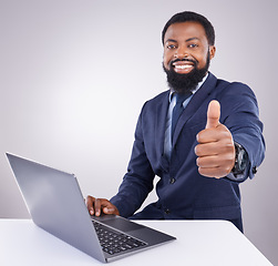 Image showing Black man, laptop and thumbs up isolated on a white background portrait for winning, online success and thank you. Happy business person or winner with yes, like and vote sign on computer in studio