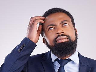 Image showing Confused business man thinking in studio of ideas, doubt and remember questions in mindset. Black male model, scratching head and looking up for solution, decision and memory of why, risk and choice