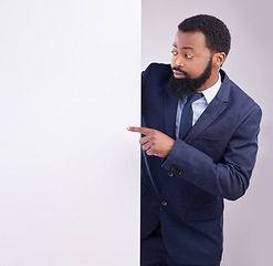 Image showing Business, black man and pointing to board in white background, studio or mockup information space. Corporate worker, model and advertising poster, marketing news sign or brand on blank mock up banner