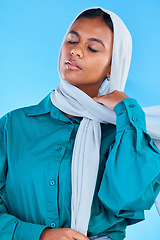 Image showing Calm muslim, woman and beauty of hijab in studio, blue background or color backdrop. Young female model, islamic culture and scarf with eyes closed in empowerment, religion and elegant arabic fashion